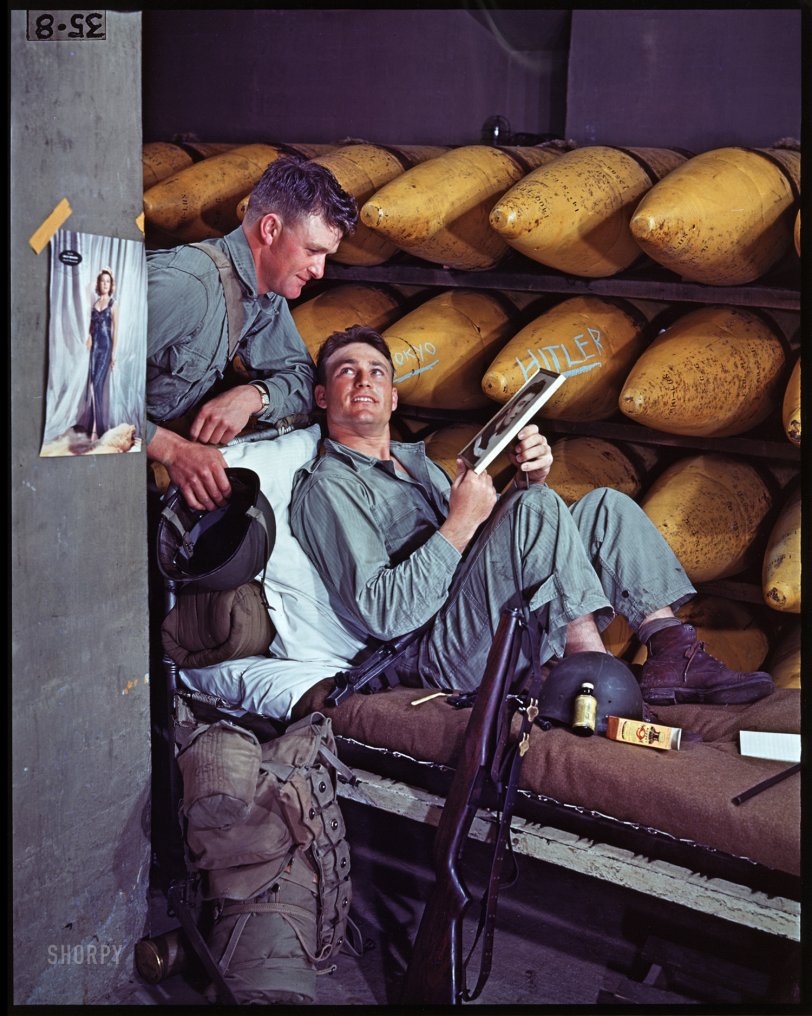 At Ease: 1943 1943. " 'At Ease.' Two soldiers in a bomb storage facility at Camp Pendleton, Calif., admiring portrait of a young woman. Pinup of Susan Hayward hangs nearby." Dye destruction print made in 2002 from Frank S. Errigo's original 4x5 Kodachrome. Exhibited in "American Treasures of the Library of Congress." View full size.