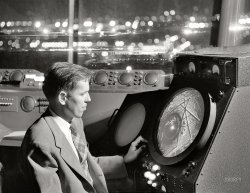 September 1952. "Man in an airport control tower looking at radar screen. Also other equipment used by air traffic controllers." Acetate negative from the Look magazine assignment "International Airport." View full size.