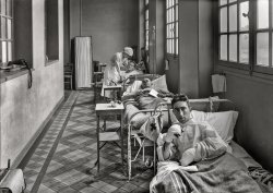 June 14, 1918. "In a corridor of the American Military Hospital No. 1 at Neuilly, France, which has been filled with beds to accommodate the overflow of wounded." 5x7 inch glass negative by Lewis Wickes Hine for the American National Red Cross. View full size.
