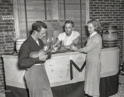 Circa 1950. "Musketeers party." Our second look at the activities of this Columbus, Georgia, social club, where the bar tricks include juggling ukulele, cigar, bourbon bottle and girl. 4x5 acetate negative from the News Photo Archive. View full size.