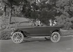 &nbsp; &nbsp; &nbsp; &nbsp; UPDATE: Commenter 426hemi has identified our mystery ride as a 1917 Olympian Motors "Tourist" touring car. The Olympian, made in Pontiac, Mich., lasted from 1917 to 1921; the image above might be, as far as the Internet is concerned, one of the very few (if not only) surviving contemporary photographs of this rare bird.
Circa 1917 San Francisco is the backdrop for this unlabeled shot of four motorists in their anonymous auto, bound for points unknown. With, by the look of things, not a moment to spare! 5x7 glass negative by Christopher Helin. View full size.