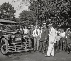Washington, D.C. September 11, 1925. "Demonstration of auto safety fender." 4x5 inch glass negative, National Photo Company Collection. View full size.

SAFETY FENDER COMPANY TO GIVE TEST HERE

&nbsp; &nbsp; &nbsp; &nbsp; "How to pick up a girl" will be practically illustrated tomorrow afternoon at 3 o'clock on Third street between Maryland and Pennsylvania avenues northwest.
&nbsp; &nbsp; &nbsp; &nbsp; Using a human being in their demonstration, the manufacturers, under the supervision of the traffic director's office, will show a recently devised scoop, which is designed so that when attached to the front of an automobile striking a person, injury is averted. -- Washington Times, 9/10/25
