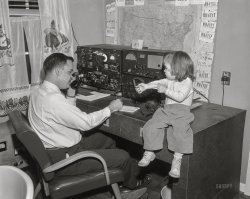 From Columbus, Georgia, around 1960 comes this News Archive photo of an amateur radio operator and his assistant, "Shortwave" Sally. 4x5 inch acetate negative. View full size.
