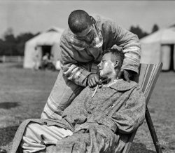 June 1918. "A serious operation by the Company Barber at American Military Hospital No. 5 at Auteuil, France. A complete portable tent hospital supported by the American Red Cross on the site of what was before the war a celebrated race-course." 5x7 glass negative by Lewis Hine. View full size.