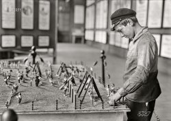 July 16, 1918. "Alex, a fourteen-year old working boy in St. Etienne, France (last seen here), was found intently studying the playground exhibit at the Children's Welfare Exposition of the American Red Cross. He has been working since 11 years of age, and said: 'On account of the high cost of living, I now get four and a half francs a day'." 5x7 inch glass negative by Lewis Wickes Hine for the American National Red Cross. View full size.