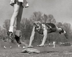 April 9, 1955. Atlanta, Georgia. "Softball or ballet? Linda McConkey, of the Lorelei Ladies softball team, diving for third base during an exhibition game; and Jerrie Rainey, playing third base for the Atlanta Tomboys, as she jumps for the ball." Wide World photo. View full size.
