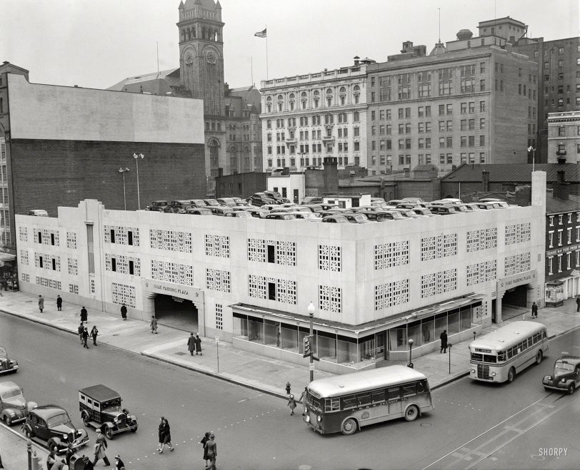 Star Parking: 1940 Washington, D.C., circa 1940. "Star Parking Plaza, 10th and E Streets N.W." This Motor Age landmark with Art Deco touches was erected by the publisher of the Washington Evening Star. The clock tower of the Old Post Office, soon to be the Trump Hotel D.C., rises at rear. 4x5 inch glass negative. View full size.