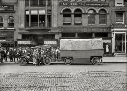 May 1921. Washington, D.C. "Charles Seeger, a composer, is a brother of Alan Seeger, the war poet. His wife is a distinguished violinist." And their baby boy will grow up to be folk legend Pete Seeger. 5x7 inch glass negative. View full size.

&nbsp; &nbsp; &nbsp; &nbsp; Ethnomusicologist Charles Seeger, seated in automobile, with family, standing, L-R: wife Constance Seeger, concert violinist, holding son Pete (1919-2014), and sons John and Charles. The family is ready to leave Washington, D.C., for their 1921 "trailer trip" musical expedition to bring classical music to rural areas.