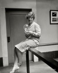 April 1926. Washington, D.C. "Miss Louise Thorne of the National Academy of Sciences holding a plant growing in an air-tight bulb." Harris & Ewing Collection glass negative. View full size.