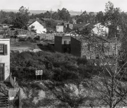 Washington, D.C., circa 1901. "View of a neighborhood of houses (and lot for sale), probably in S.W." 8x10 inch glass negative from the D.C. Street Survey Collection. View full size.
