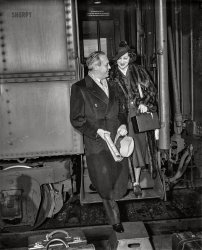 March 13, 1936. Washington, D.C. "Man and woman disembarking from train." 4x5 inch glass negative, Harris & Ewing Collection. View full size. Washington Post, March 14, 1936:


Arriving for Week at Loew's Fox
&nbsp; &nbsp; &nbsp; &nbsp; Arriving in the Capital early yesterday morning, Jack Benny and Mary Livingstone -- Mrs. Benny in private life -- were met and breakfasted by a group of Loew's executives and newspaper representatives. Mr. and Mrs. Benny are here for a week of personal appearances, in conjunction with an elaborate stage revue, at Loew's Fox Theater. Mr. Benny's Sunday night broadcast will be made from the auditorium of the National Press Club ...