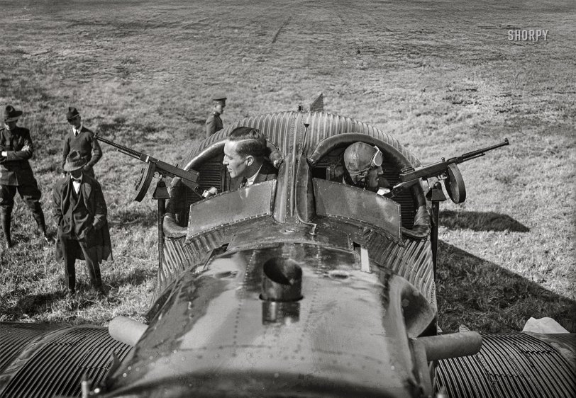 Washington, D.C. -- October 22, 1921. "Junkers-Larsen 'JL-12,' the dreadnaught of the air, arrived at Bolling Field yesterday after a 2½-hour flight from Long Island, New York. Designed principally for attack on enemy troops, it is equipped with 30 Thompson submachine guns and can discharge 3,000 bullets in four seconds. George Wise, machine gun expert, and Brooke Hyde-Pearson [1894-1924], pilot of the JL-12, preparing to demonstrate two of the machine guns." (Washington Post) 4x5 inch glass negative, Harris & Ewing Collection. View full size.