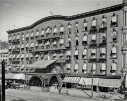 Buffalo, New York, circa 1900. "Tifft House, Main Street." Demolished 1902; home to Minehan's Hair Store (offering "a full line of switches, waves, fringes and wigs"). 8x10 inch glass negative, Detroit Photographic Company. View full size.