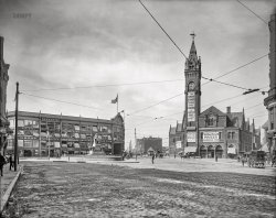 Boston circa 1906. "Park Square." The Motor Mart Garage at left, behind Thomas Ball's "Emancipation" statue of Abraham Lincoln and a figure based on Archer Alexander, the last man captured under the Fugitive Slave Act. At right, the Boston & Providence Railroad Depot and clock tower. 8x10 inch dry plate glass negative, Detroit Publishing Company. View full size.