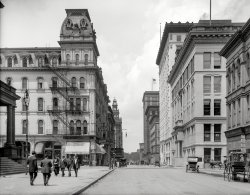 Toledo, Ohio, circa 1909. "Madison Avenue." Fast-forward a few years from our previous view of downtown Toledo and we now have automobiles and a "New Boody." Which if you ask us looks very much like the Old Boody. View full size.