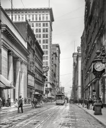 Circa 1907. "Fourth Street, Cincinnati, Ohio." Where the brands vying for your trade include Mullane and Wurlitzer.  8x10 glass negative. View full size.