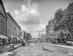 1908. "Main Street -- Nashua, New Hampshire." At right, offices of the Nashua Telegraph and Fletcher's Optical Parlors. 8x10 inch glass negative, Detroit Publishing Company. View full size.