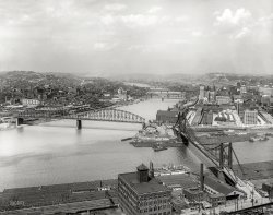 Pittsburgh circa 1912. "Coal barges at 'The Point' -- Confluence of Allegheny and Monongahela at start of Ohio River." A bounty of seven spans for you bridge identifiers out there. 8x10 inch dry plate glass negative. View full size.
