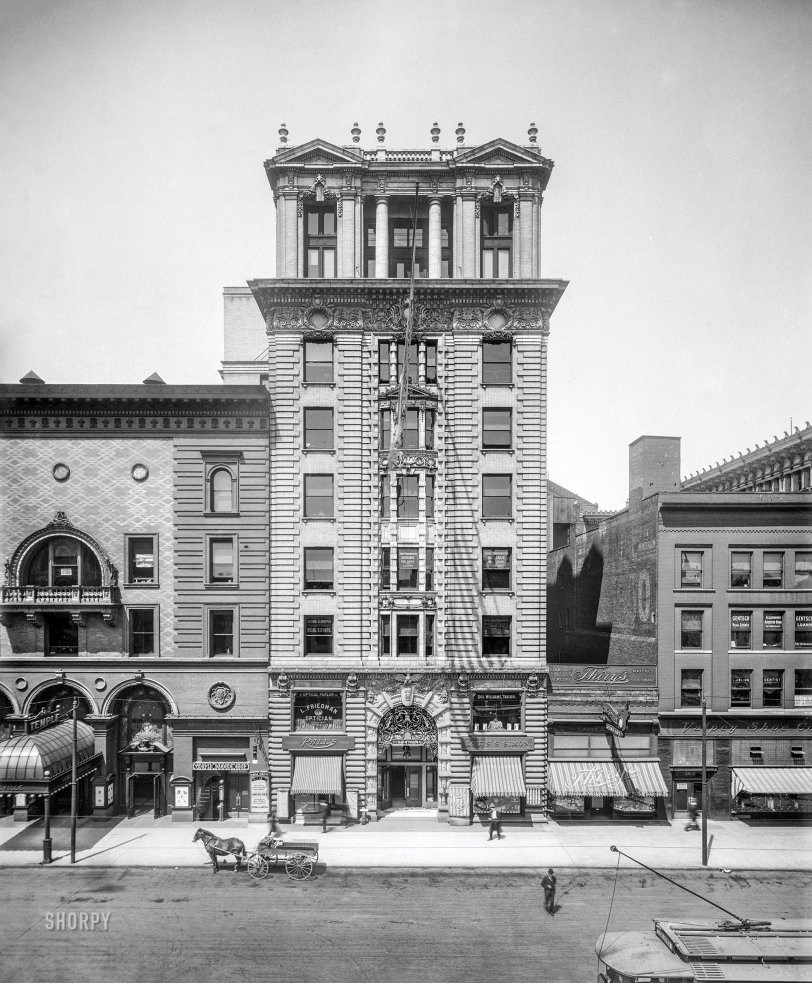 Elks Temple: 1910 "Elks Temple, Monroe Avenue, Detroit." Next door to the Temple Theatre, where a poster advertises performances the week of May 1, 1910, of "School Boys and Girls," starring the English boy soprano Albert Hole. 8x10 glass negative, Detroit Publishing Co. View full size.