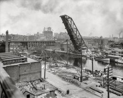 Cleveland circa 1910. "Lift Bridge (raised) and Superior Avenue Viaduct (swing bridge at left), Cuyahoga River." 8x10 inch glass negative, Detroit Publishing Company. View full size.