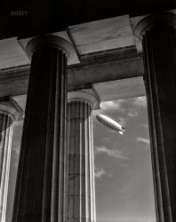 November 2, 1931. Washington, D.C. "Navy airship U.S.S. Akron over the Lincoln Memorial." 4x5 inch nitrate negative by Theodor Horydczak. View full size.


THE AKRON'S VISIT.
&nbsp; &nbsp; &nbsp; &nbsp;  The giant airship Akron arrived yesterday to salute the Capital on its first flight, after having been  officially dedicated to Navy service on Navy Day. Accompanied  by its older, slimmer sister, the Los Angeles, the Akron, bearing 108 men, circled over the city, dipped in salute to the White House, and gave Washingtonians their first chance to see the  world's largest and newest dirigible. (Washington Post, 11.3.31)
