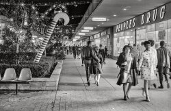 December 12, 1967. Wheaton, Maryland. "Shoppers walk past People's Drug and Christmas decorations at Wheaton Plaza shopping center." Back when "shopping days until Christmas" was a thing. 35mm negative by Warren K. Leffler for U.S. News & World Report. View full size.