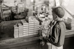 July 1941. "Store with cap guns and fireworks for sale, Fourth of July, Vale, Oregon." 35mm acetate negative by Russell Lee for the Farm Security Administration. View full size.