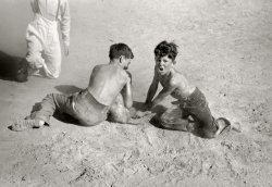 July 1941. "Greased pig race, Fourth of July. Vale, Oregon." 35mm acetate negative by Russell Lee for the Farm Security Administration. View full size.