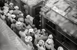 July 1941. "Chicago, Illinois. Commuters waiting for southbound trains." 35mm acetate negative by John Vachon for the Farm Security Administration. View full size.