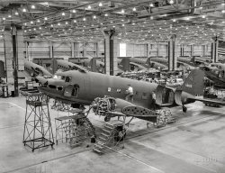 October 1942. "A long line of C-47 transport planes awaits the installation of wings at the Long Beach, California, plant of Douglas Aircraft Company. The versatile C-47 performs many important tasks for the Army. It ferries men and cargo across oceans and mountains, tows gliders and brings paratroopers and their equipment to scenes of action." Note how, as on the photo in the previous post, certain markings on the fuselage have been scratched off the negative. Photo by Alfred Palmer for the Office of War Information. View full size.