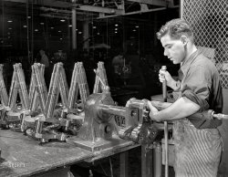 June 1942. East Hartford, Connecticut. United Aircraft plant. "Single-row crankshaft assemblies for Pratt & Whitney airplane engines. The large Eastern plant at which the work is done is producing a steady flow of power installations for the fighting craft of our Army and Navy air forces." 4x5 inch nitrate negative by Andreas Feininger for the Office of War Information. View full size.