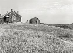 August 1940. "Tourist house in Truro, Massachusetts. The girl at the easel is a boarder. House belongs to incapacitated Portuguese fisherman and railroad worker from the Cape Verde Islands. He and his wife now make most of their income from boarding tourists in their lovely house during the short three-month season." Medium format negative by Edwin Rosskam. View full size.