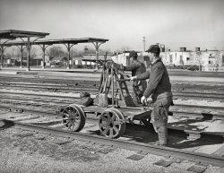 February 1940. "Railway workmen with handcar. Oklahoma City, Oklahoma." Photo by Russell Lee for the Farm Security Administration. View full size.
