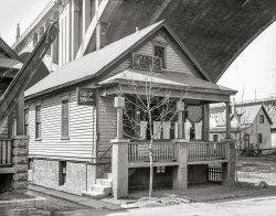 April 1936. "Housing conditions in crowded parts of Milwaukee. Housing under Wisconsin Avenue viaduct." Photo by Carl Mydans for the Resettlement Administration. View full size.