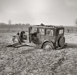 February 1937. "Posey County, Indiana. Havoc wrought on farmland, highways, roads, farm buildings, equipment, homes by 1937 flood. Automobile after the flood on Mackey Ferry Road near Mount Vernon." Photo by Russell Lee for the Farm Security Administration. View full size.
