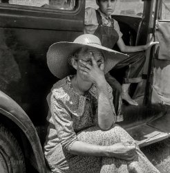 July 1938. Douglas, Georgia. "Wife of sharecropper in town to sell their crop at the tobacco auction." Medium format negative by Dorothea Lange. View full size.