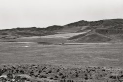 April 1939. "U.S. 99 on ridge over Tehachapi Mountains. Heavy truck route between Los Angeles and San Joaquin Valley over which migrants travel back and forth." 4x5 inch nitrate negative by Dorothea Lange for the Farm Security Administration. View full size.