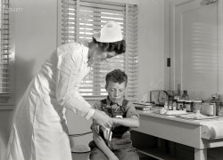 May 1939. "Farm Security Administration camp at Farmersville, Tulare County, California, for migratory agricultural laborers. Migratory boys come to the clinic for attention of the resident nurse of the Agricultural Workers' Health and Medical Association." 4x5 nitrate negative by Dorothea Lange for the FSA. View full size.
