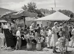 July 1941. "Carnival attractions in Vale, Oregon, on the Fourth of July." Acetate negative by Russell Lee for the Farm Security Administration. View full size.
