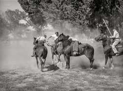 July 1941. "Getting potatoes from bucket in potato race at the Fourth of July celebration in Vale, Oregon." Photo by Russell Lee for the Farm Security Administration. View full size.