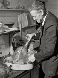 November 1940. "Ledyard, Connecticut. Mr. T.L. Crouch, a Rogerine Quaker, preparing to carve the Thanksgiving turkey." Photo by Jack Delano for the Farm Security Admin. View full size.