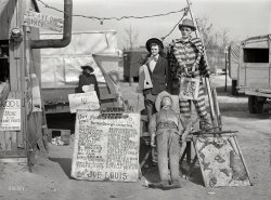 March 1941. "A traveling side-show. 'Crime Museum,' consisting of dilapidated effigies of famous criminals run by an old, shell-shocked World War veteran. Near Fort Bragg, North Carolina." Acetate negative by Jack Delano. View full size.