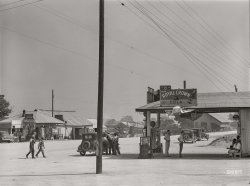 June 1941. "The center of Woodville. Greene County, Georgia." Medium format acetate negative by Jack Delano for the Farm Security Administration. View full size.
