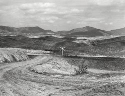 September 1939. "Ducktown, Tennessee. Fumes from smelting copper for sulfuric acid have destroyed all vegetation and eroded the land." Medium format acetate negative by Marion Post Wolcott for the Farm Security Administration. View full size.