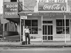 December 1940. "Construction of Army training camps around Alexandria, Louisiana. East Side Cafe with rooms for rent, 'Soldiers Welcome,' on highway to Camp Livingston." Acetate negative by Marion Post Wolcott for the Farm Security Administration. View full size.
