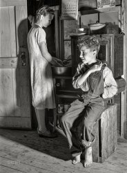 July 1940. "Interior of one-room cabin occupied by migrant fruit pickers and packinghouse workers. Rent one dollar and seventy-five cents a week. The father picks cherries, mother works in a packing plant. Berrien County, Michigan." Photo by John Vachon. View full size.