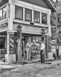 June 1941. Burns City, Indiana. "Office of land use committee and FSA office for relocation project in Martin County, where 160 farm families will be moved during construction of naval ammunition depot." Photo by John Vachon for the Farm Security Administration. View full size.