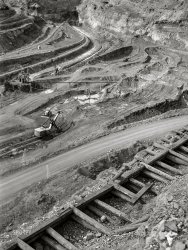 August 1941. "Albany Mine, Hibbing, Minnesota. Iron ore from this mine is brought up by truck." Acetate negative by John Vachon for the Farm Security Administration. View full size.