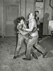 February 1942. Woodville, California. "FSA farm workers' community. Boys in recreation room." Acetate negative by Russell Lee for the Farm Security Administration. View full size.