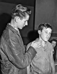 February 1942. Woodville, California. "FSA farm workers' community. Demonstration of 'pressure spot' to stop arterial bleeding at the first aid class." Medium format acetate negative by Russell Lee for the Farm Security Administration. View full size.